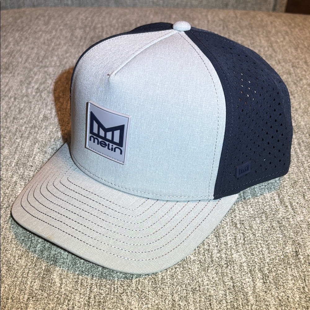 Melin Odysea Grey and Navy Hat-New Never Worn.  6 others to sell.  All like new.